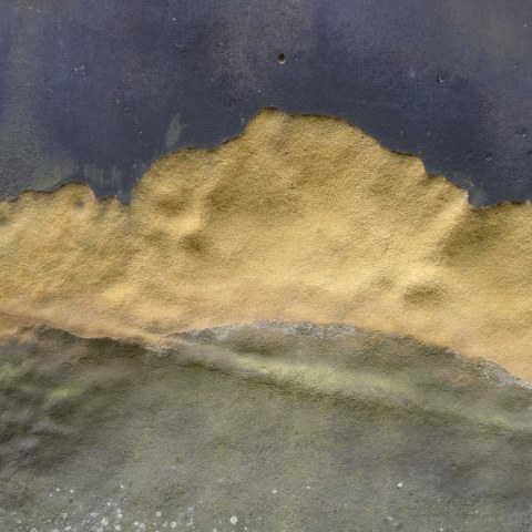 d10952: semi-abstract photo (weathered gravestone in St Mary's churchyard, Scarborough) by Ewart Shaw